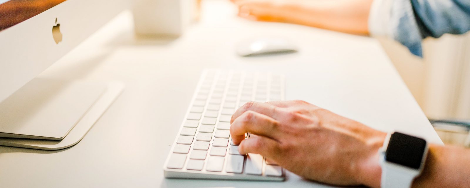 hand typing on a mac