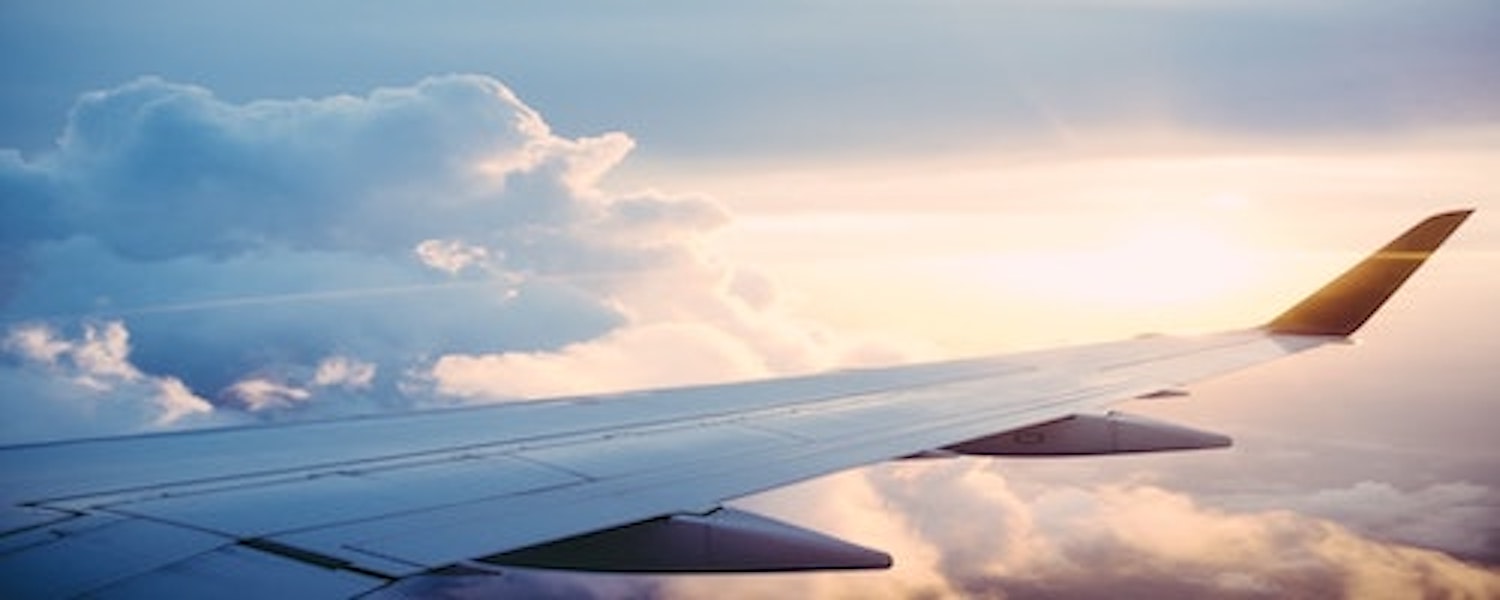 Plane wing over the clouds